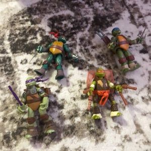 Teenage Mutant Ninja Turtle Set Of 4 With All The Weapon Accessories